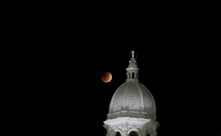 A total lunar eclipse took place between 5:16 a.m. and 6:41 a.m. over the East Coast of the United States Tuesday morning as the moon passed entirely into the Earth’s shadow. The beginning of the red eclipse could be seen just beyond the Historic Courthouse. According to NASA’s website, the next total lunar eclipse won’t take place again until March of 2025. (Photo by Scoggins)