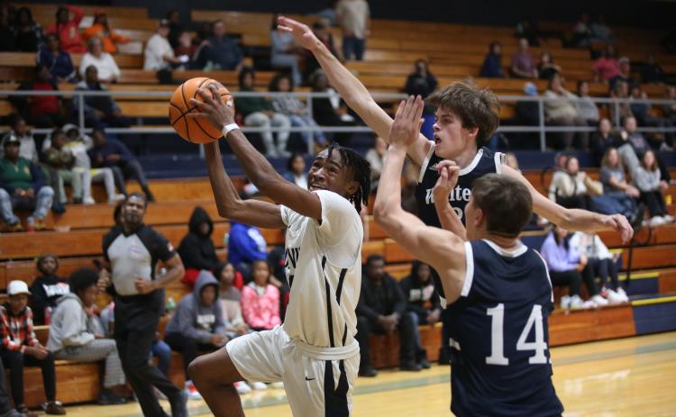 Junior Kamaurion “Tank” Givens goes for the basket during the Devils’ loss to White County during a scrimmage in the Inferno Thursday, Nov. 10. The Devils are looking to bring the mantra of “HEAT” to the Inferno this season under new Head Coach Ed Geth. (Photo by Wells)