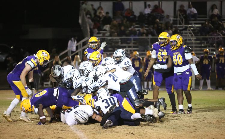 A Devil dogpile attempts to recover a fumbled ball during the last regular season game vs. Athens Christian Oct. 28. The Devils are looking to make it past the first round of the GHSA state playoffs Friday, Nov. 11. (Photo by Scoggins)