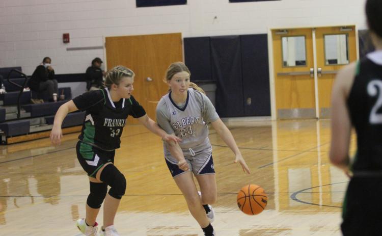 Eighth grader Audrey Lunsford takes the ball down the court during the Lady Rams’ win over Franklin County Monday. (Photo by Wells)