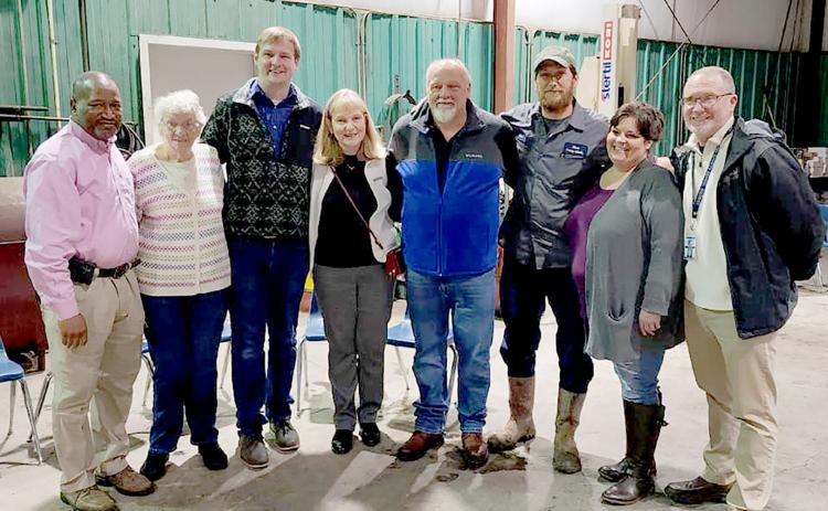 Pictured during a retirement party for former Elbert County School District Director of Transportation Mark Cartledge are (L-R) current director Darin Rucker, Peggy Cartledge, Caleb Cartledge, Carol Cartledge, Mark Cartledge, Clint Webb, Dawn Royston and Superintendent Jon Jarvis.