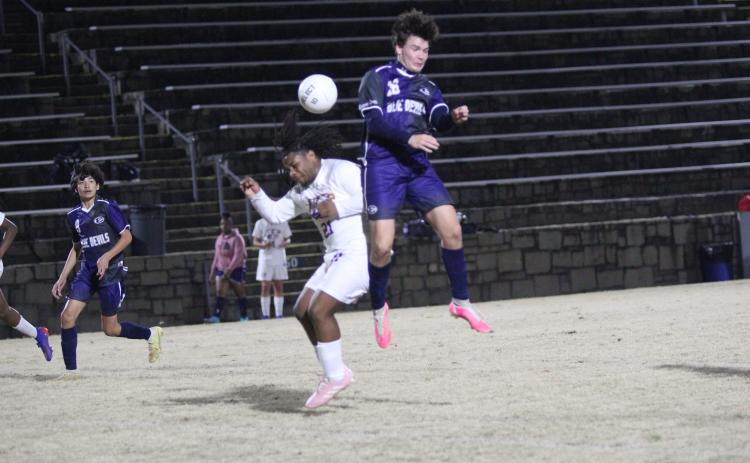 Junior Brandon Horne scored three goals during the Devils’ 8-4 win over Athens Christian Feb. 14 in the Granite Bowl. (Photo by Wells)