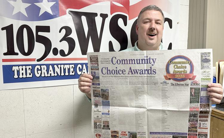 WSGC Radio station owner and operator Stan Brown encourages citizens to vote in the Community Choice Awards. (Photo by Scoggins)