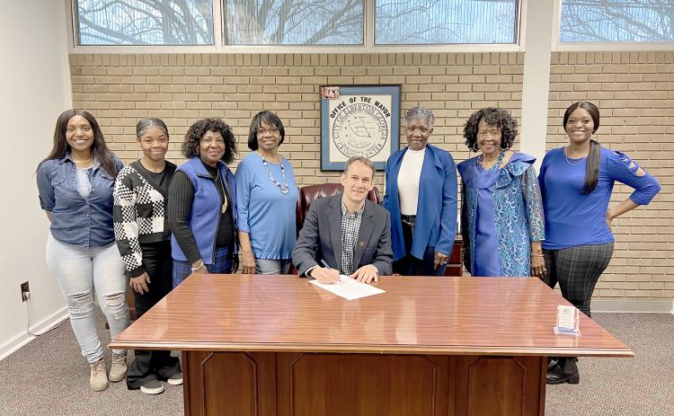 Pictured during the proclamation signing are (L-R) Sherell Eberhardt, Tiyah Turman, Edna Eberhardt, Margie Hunter, Graves, Pamela Allen, Lenora Dubose and Tiara Eberhardt.