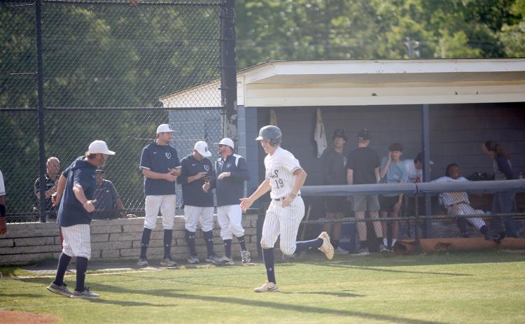 Diamond Devil Lawson Adams high-fives Head Coach Lance Ingram as he trots down the third-base line following his first-inning home run in Elbert’s 8-7 loss to Social Circle in the first game of the Sweet Sixteen series. (Photo by Wells)