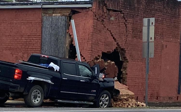 A single vehicle accident cause damage to the old Wray’s Drug Store building on the Bowman Square Sunday morning. (Photo courtesy of Elbert County Emergency Services)