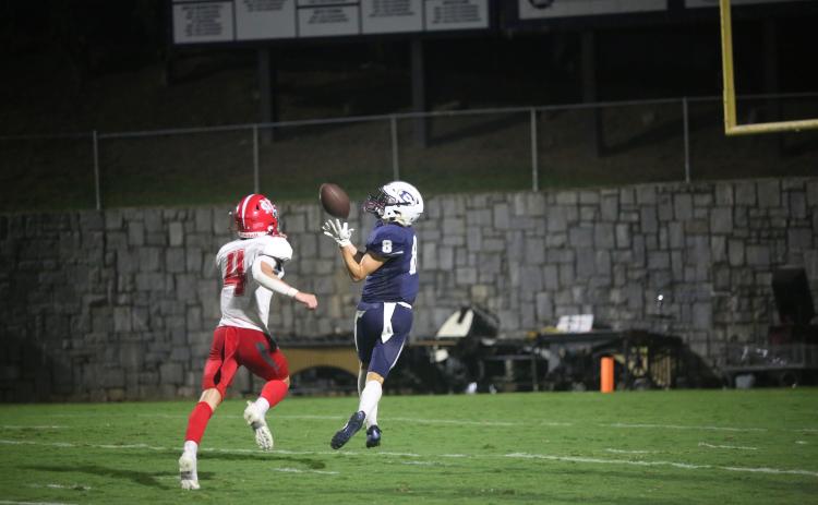 Eli Harris catches a 40-yard touchdown pass in Elbert County’s 55-35 loss to Madison County Aug. 25. Harris finished with four catches for 65 yards and a touchdown in the loss. (Photo by Wells)