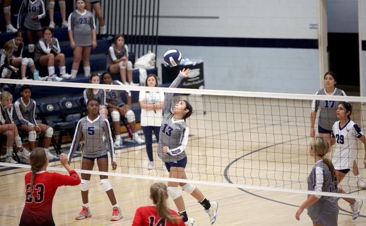 Sophia Vargas leaps as she spikes the ball in Elbert County Middle School’s 2-0 win over Rabun County Aug. 28. (Photo by Wells)