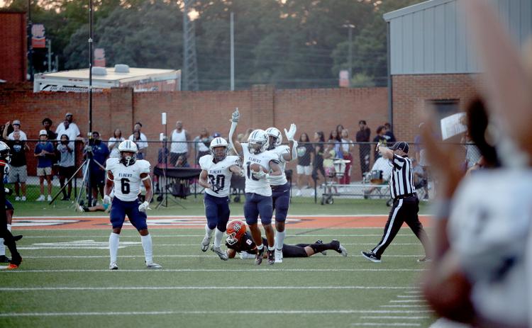 Elbert County Blue Devils (L-R) Trevion Swinger, Miguel Rodriguez, D.J. Fortson and Reunte Tucker celebrate after Fortson recovered a Hart County fumble. Elbert went on to win the game 24-14 and are ranked No. 4 in Class A Division 1 by the Atlanta Journal-Constitution. (Photo by Wells)