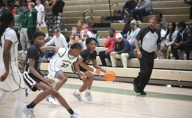 Tank Givens dribbles past an Athens Academy defender during Elbert’s loss to the Spartans Dec. 8. (Photo by Wells)