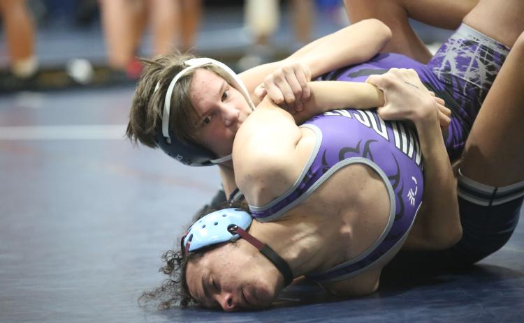 Hudson Fleming traps his opponent’s arm on his way to a pin during Elbert’s 77-6 dual win over Duluth Dec. 9. (Photo by Wells)