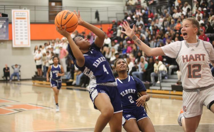 No. 4 Kaylen Rucker leans away from a Hart County defender as she gets a shot up in Elbert’s loss to Hart County. (Photo by Wells)