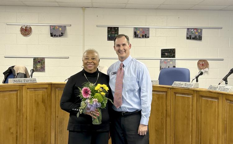 BOE Chair Teresa Barnett and Superintendent Robert Wheeler pose for a picture after Barnett was recognized for her 17 years of service to the BOE. (Photo by Wells)