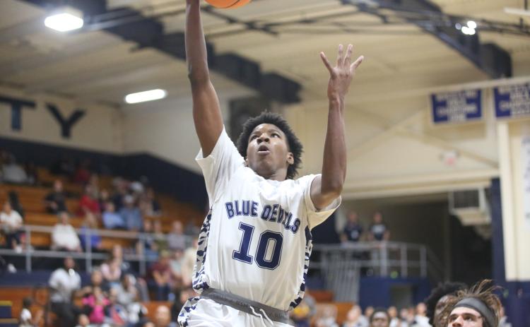 A.J. Brown punctuates an Elbert fast break with a slam dunk. (Photos by Wells)