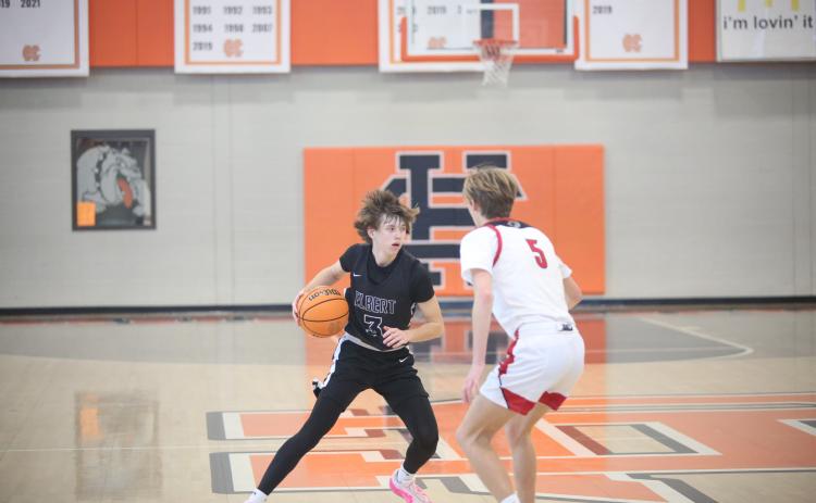 Grady Jones tries a crossover move on a Social Circle defender. (Photo by Wells)