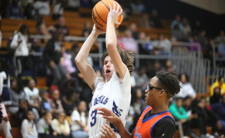 Grady Jones goes up with the ball as he tries to lay the ball into the basket during Elbert’s loss to Cedar Shoals. (Photo by Wells)