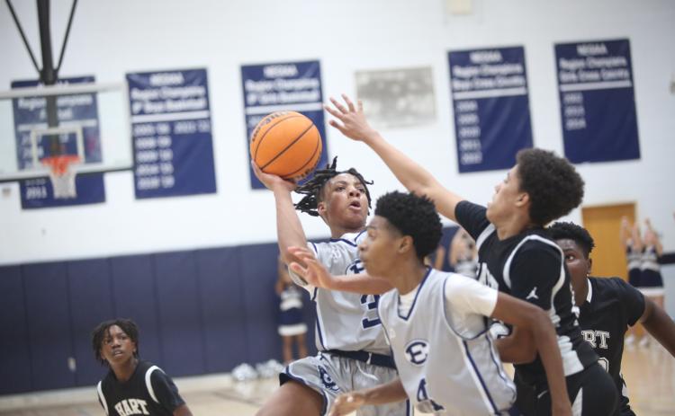 Elijah Gaines gets a shot up past a Hart County defender against the Bulldogs Jan. 11. (Photo by Wells)
