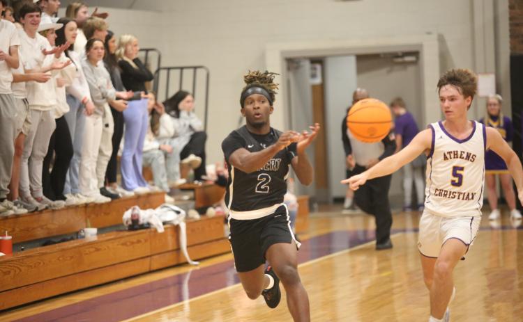 Boaz Goodman passes to a teammate during Elbert’s game against Athens Christian Jan. 12. (Photo by Wells)