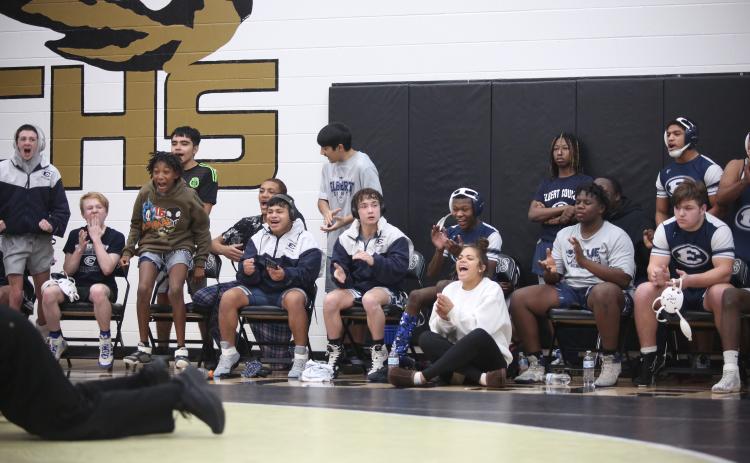 The Elbert bench reacts after teammate Brycin Hughes pins a Towns County wrestler during the area championship Jan. 13 at Commerce High School. (Photo by Wells)