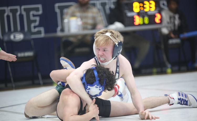 Cooper West works his opponent as he earns a pin in his opening match of the Area 8A Championships held in the Inferno Feb. 2. (Photo by Wells)