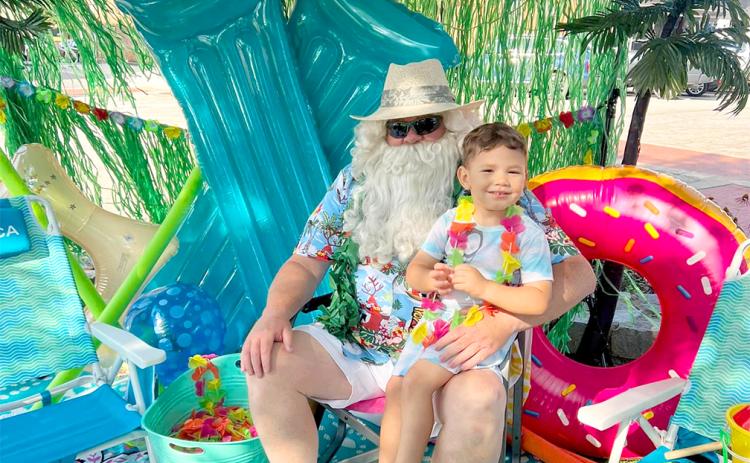 Dakota Johnson "chilled out" with Santa at Main Street's 2023 Christmas in July event on the public square.