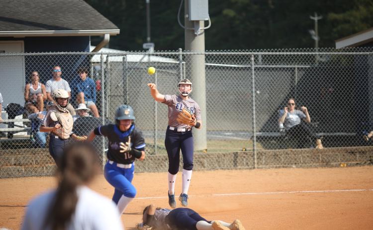 Audrey Lunsford leaps and throws over Ky Dubose during the 2023 season. Lunsford, Dubose and the Lady Devils softball team are scheduled to start their 2024 season with an away game against North Oconee Aug. 1. (File photo by Wells)