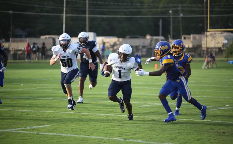 No. 1 Ty’Rikis Jones throws out a stiff arm during a long reception in the Aug. 2 scrimmage against Washington-Wilkes. (Photo by Wells)
