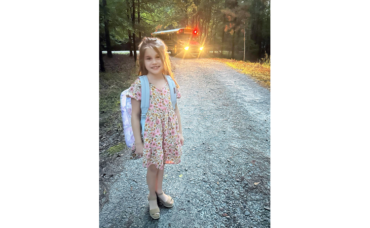 Third grader Gabby Ray is ready to start the new school year as she waits for the bus to take her to Elberton Elementary.  "I was a little nervous, but my first day was great. My teacher is very fun and nice, and my classroom is cool-looking. My favorite part of the day was getting on the bus to see my friends," Gabby said. (Photo submitted by Kristy McCannon)