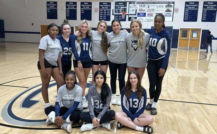 The Lady Devils volleyball team poses for a picture after picking up a 2-0 win over Washington-Wilkes. Aug. 20.