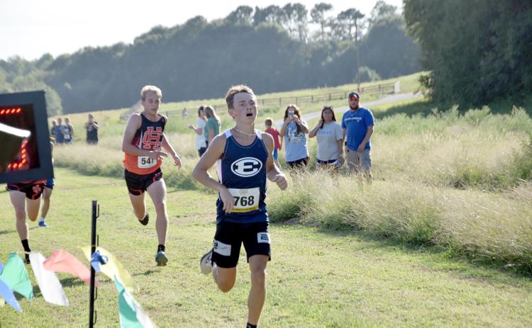 Dakota Toole crosses the finish line in third place overall during the Bill Woods Pridelands High School Invitational Sept. 7. (Photo by Shane Scoggins - Franklin County Citizen)
