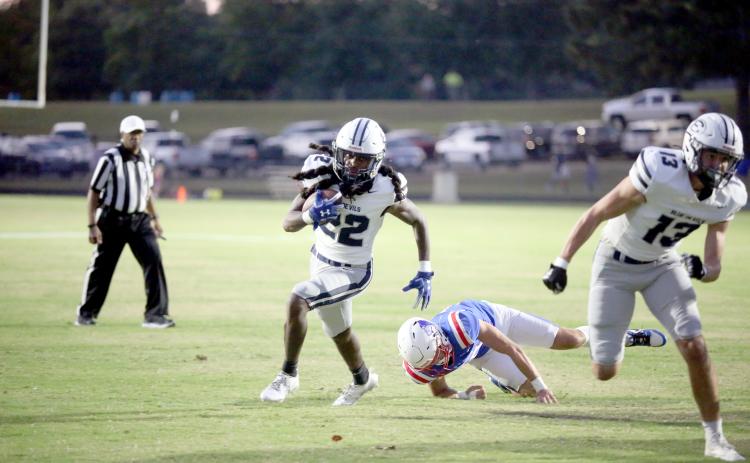 Elbert running back Jacari Barnett leaves an Oglethorpe defender in his wake as he rushes into the end zone for his first of three touchdowns. (Photo by Wells)