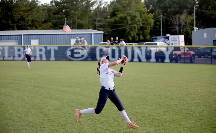 Hannah Brady makes a leaping catch in the outfield. (Photo by Wells)