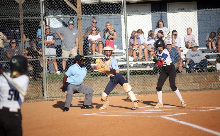 Reagan Baker pops up and looks to first after fielding a pitch during the game against Barrow Arts and Sciences Academy. (Photo by Mark Wells)