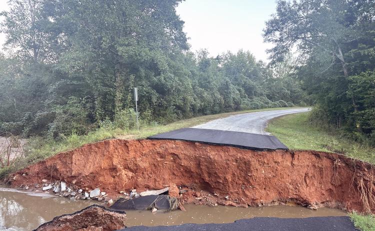 The rate at which water fell Thursday into Friday morning caused several areas of roads to fail including this 35-foot wide washout in the Moore Road/Craft Road area in the Rock Branch community. (Photo submitted by Monica Vickery)