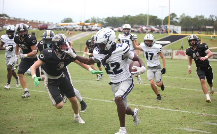 Jacari Barnett stiff arms a Commerce defender during Elbert County’s 42-27 loss to Commerce Sept. 28. Barnett led the team in rushing yards after gaining 130 yards on 20 carries. (Photo by Wells)