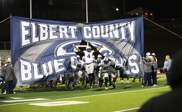 Senior Jayven Hickman leads the team onto the field at the beginning of the playoff game against Heard County High School in Franklin Friday, Nov. 22. The Blue Devils bested the Braves 26-24, qualifying them as one of the "Elite Eight" in the Class A Division 1 State Tournament. The Devils will face the Toombs County Bulldogs Friday in Lyons. Check the ECCHS Athletics website to comfirm the start time. (File photo by Wells)