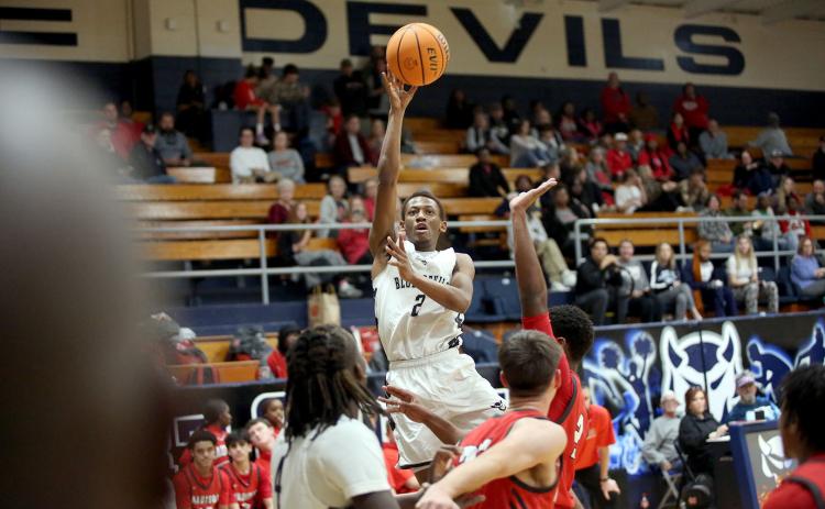 Jordon Morrison rises and attempts a floater during Elbert’s loss to Madison County Dec. 7. (Photo by Wells)