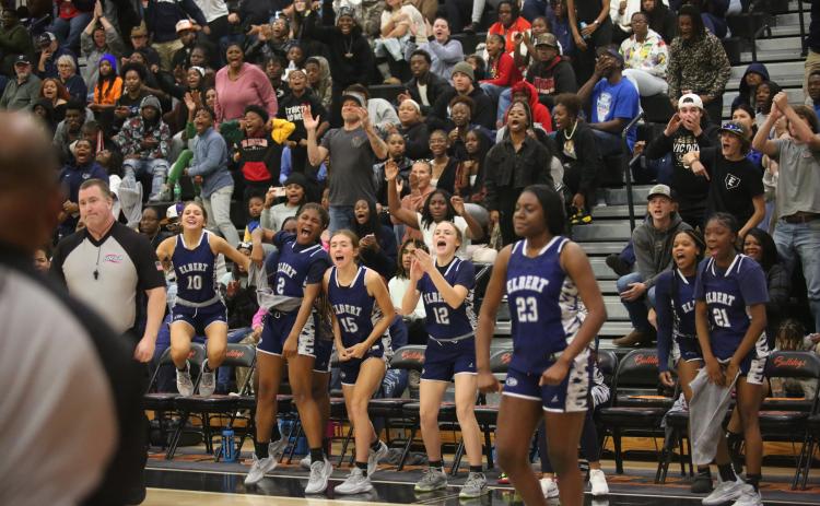 The Lady Devils bench celebrates a point while No. 23 Zy Belcher flexes. Belcher and the Lady Devils are 3-0 on the season after Elbert dominated Washington-Wilkes in the Inferno Nov. 30. (File photo by Wells)