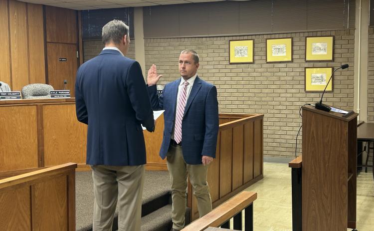 Elberton Mayor Daniel Graves (left) swears in city council member Kyle Parham  (right) as the 2025 Mayor Pro Tempore during the Jan. 6 regular meeting. (Photo by Wells)