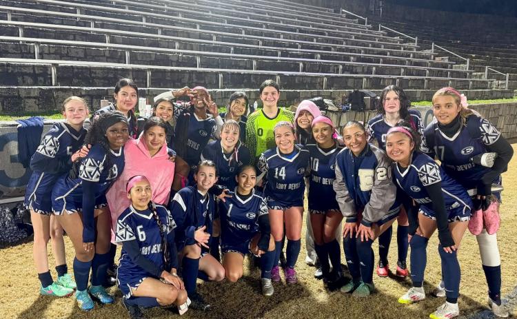 The Lady Devils soccer team poses for a team picture after dominating Jefferson County by a score of 9-0 in the Inferno Feb. 11. (Photo by Wells)