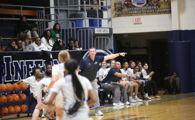 Head Coach Josh Jones (left) and Assistant Coach Sonee Bennett (right) direct traffic on the court during an Elbert game in the Inferno.