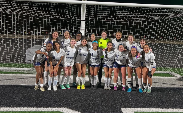 Elbert County's Lady Devils soccer team poses for a team picture after beating Franklin County on the road Feb. 24. The Lady Devils and Blue Devils soccer teams are scheduled to play Rabun County in a rescheduled game tomorrow with the Lady Devils kicking off at 5:30 and the Devils starting at 7:30. (Photo courtesy of Elbert County Lady Devils Soccer)
