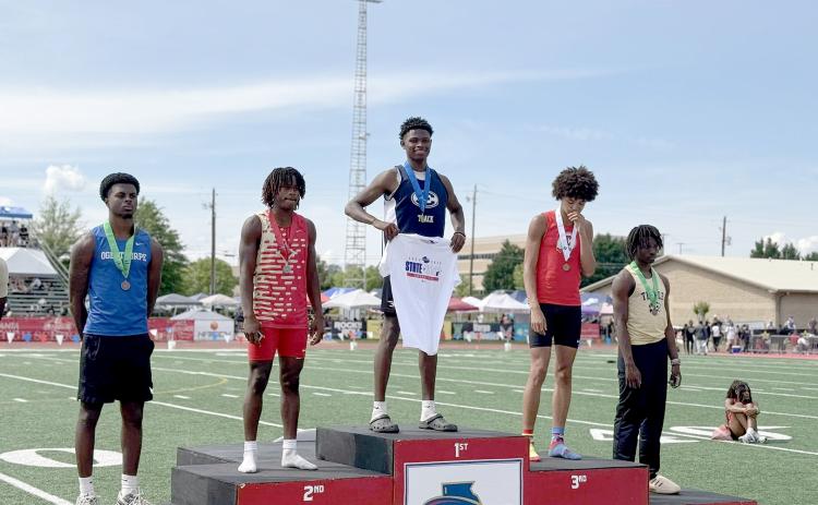 Elbert County track athlete D.K. Winn won a state championship for triple jump during the GHSA State Track Meet in Rome May 9. Winn jumped a distance of 46 feet, 11.5 inches, beating the second place athlete by a total of 10 inches. (Photo courtesy of ECCHS Athletics)