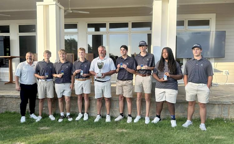 (L-R) Coach Sandy Thornton, Carson Amabile, Kale Kurtz, Madden Drake, Head Coach Larry Kesler, Nolan Henderson, Landen Adams, Caleb Burton and Brayden Edwards pose with the GHSA Golf State Championship trophy after finishing first in the state at Arrowhead Pointe May 19 and May 20. (Photo courtesy of Elbert County Golf)
