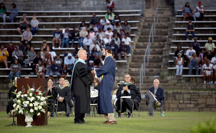 Brady Dickerson receives the Faculty Cup from ECCHS Principal Josh Rider. (Photo by Wells)