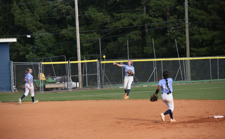 Audrey Lunsford rockets the ball towards home plate during Elbert’s win over Lincoln County Aug. 14. (Photo by Bo Underwood)