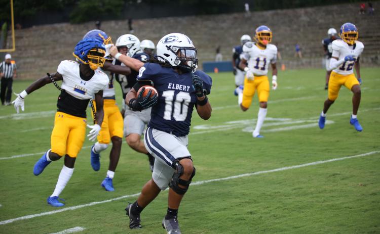 Running back D.J. Fortson carries the ball in a scrimmage between Elbert County and Washington-Wilkes on August 1. (Photo by Bo Underwood)