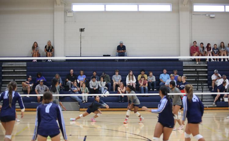 Freshman libero Sophia Vargas dives to save the ball in Elbert County's Aug. 7 match against Johnson. (Photo by Bo Underwood)