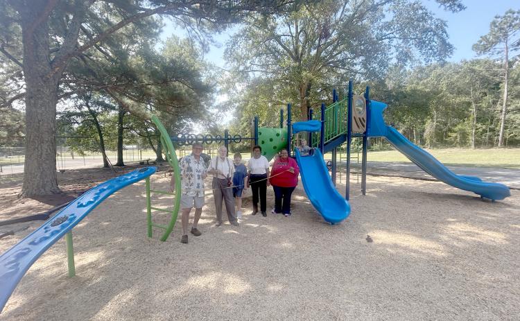 Mayor Scott Harpold, John Beucler, Lera Ray, council member Henrietta Maxwell and city clerk Tiffany Verdell pose at the ribbon cutting for Bowman's new playground. (Photo by Mark Wells)