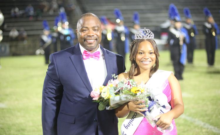Jaslyn Huff (right) sports her homecoming queen crown alongside her father Jasper Huff (left) . (Photo by Bo Underwood)
